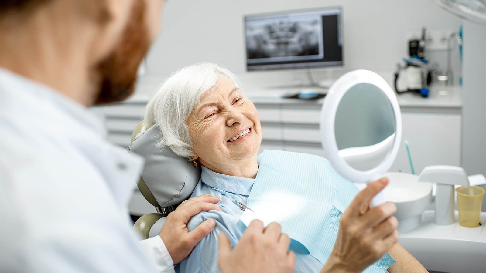 Patient smiling after quality dental care